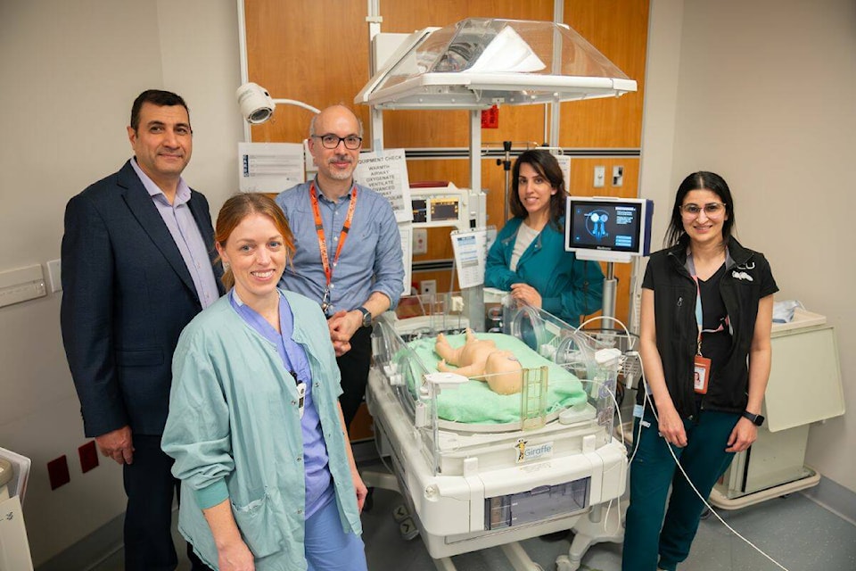 Surrey Memorial Hospital’s NICU clinicians pause for a photo while being trained on the Near Infrared Spectroscopy (NIRS) monitoring devices that the Surrey Hospitals Foundation purchased thanks to donors Ken and Ena McIntosh. (Photo: Surrey Hospitals Foundation) 