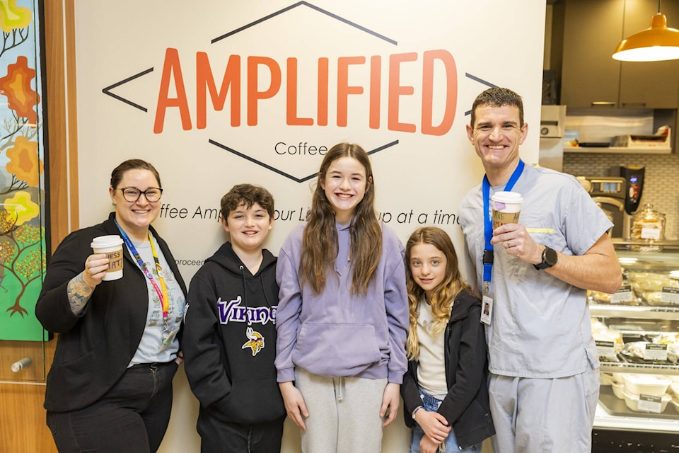 Students from Okanagan Waldorf School joined VJH staff member Andrea Schroeder (left) and Dr. Yann Brierley to kick-off the Community Kudos Coffee Sleeve Project. (VJH Foundation photo) 