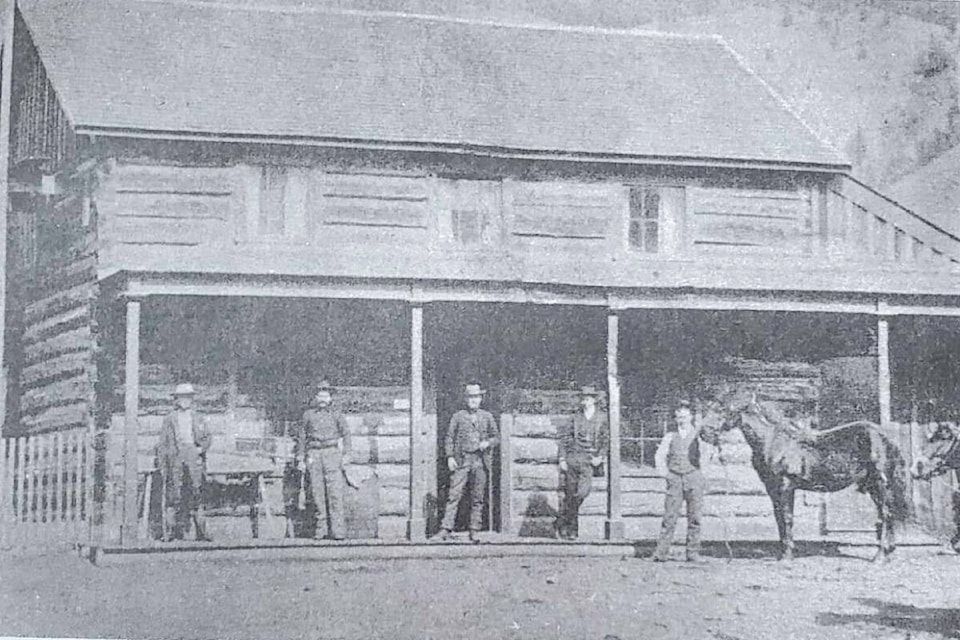 Dog Creek House in the late 1800s, with owner Joe S. Place standing in the doorway.  (Photo from Tribune, Centennial Edition, July 1958). 