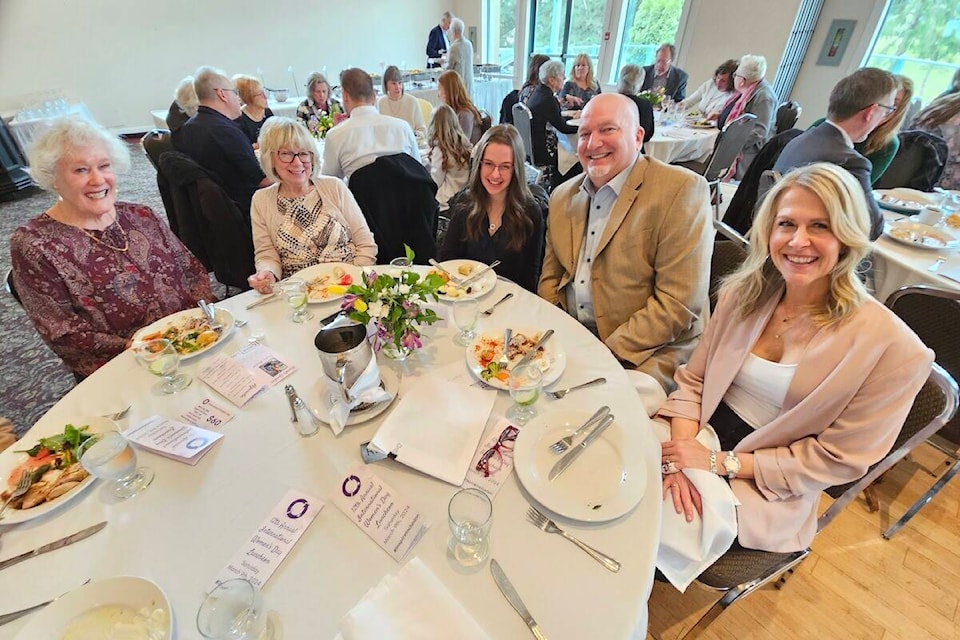 Keynote speaker Taylin McGill (centre) shared a table with her parents Sean and Erin (right) and grandmothers Renee Davis and Audri McGill at the 12th annual Rotary Clubs of 91ԭ International Women’s Day luncheon on Saturday, March 9. (Dan Ferguson/91ԭ Advance Times) 