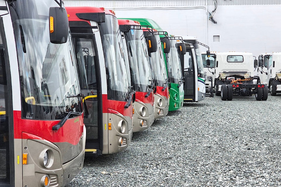 Buses and trucks were parked in a fenced-in lot outside the Vicinity Motor Corporation Aldergrove plant on Saturday, March 9. Vicinity has announced plans to develop an autonomous bus with a U.S. software company. (Dan Ferguson/Langley Advance Times) 