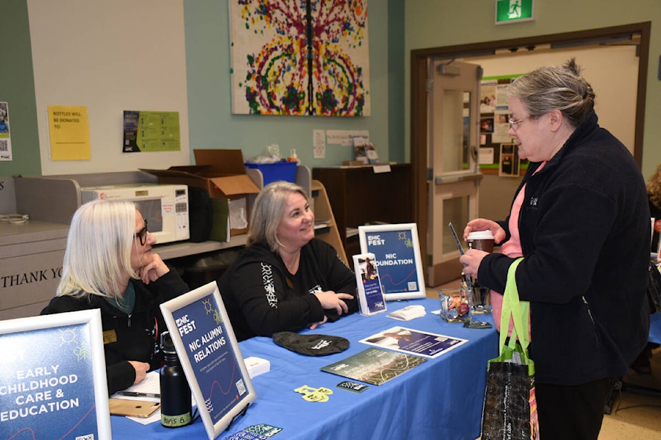 A visitor talks with Paris Gaudet, left, and Jenni Osborne at NIC Fest on the Port Alberni campus March 6, 2024. (SUSIE QUINN/ Alberni Valley News) 