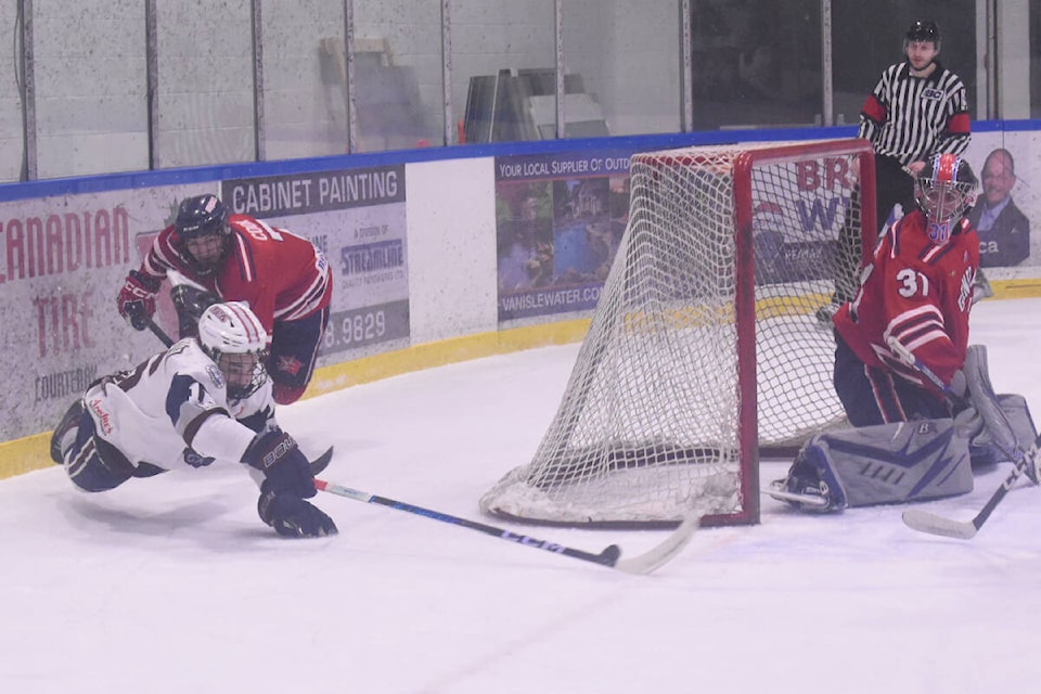 Down, but not out! Comox Valley forward Ivan Kedrov is airborne as he centres the puck during the VIJHL game against the Oceanside Generals on Friday, March 8. Photo by Terry Farrell, Comox Valley Record 