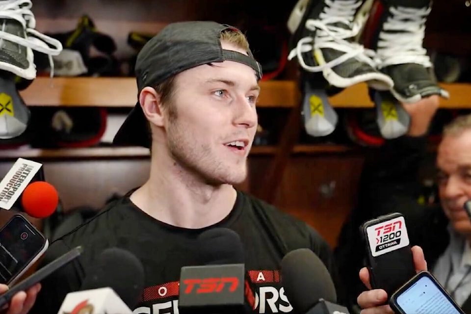 Zack Ostapchuk was surrounded by microphones following the former Vancouver Giants team captain debut with the Ottawa Senators on Tuesday, March 12. (Ottawa Senators) 