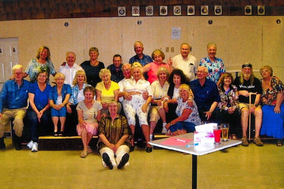 Susie Francis, seated on floor, is seen at the Cloverdale Legion with 23 members of the golden-age entertainment troupe the Versatiles in this undated image. “Susie Francis and the Versatiles” are calling it quits after nearly a quarter-century of entertaining audiences across B.C. (Photo submitted: Susie Francis) 