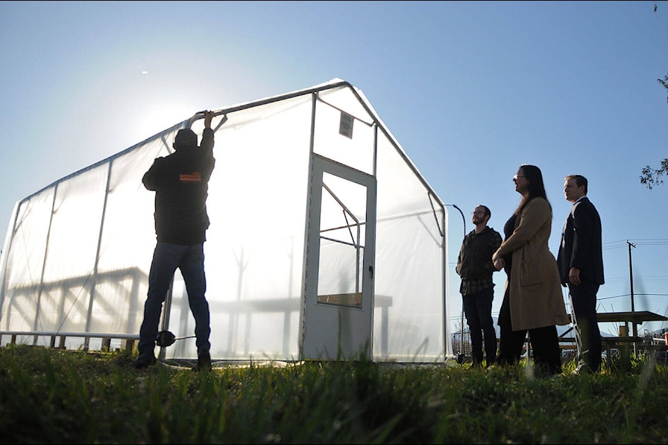 From left: Wayne Goodwin, Stewart Fuoco, Michelle Dennill and Chris Csoka check out a greenhouse that the Chilliwack Bowls of Hope Society won for its Community Roots garden in a contest put on by Goodwin’s Greenhouses of Abbotsford. (Jenna Hauck/ Chilliwack Progress) 
