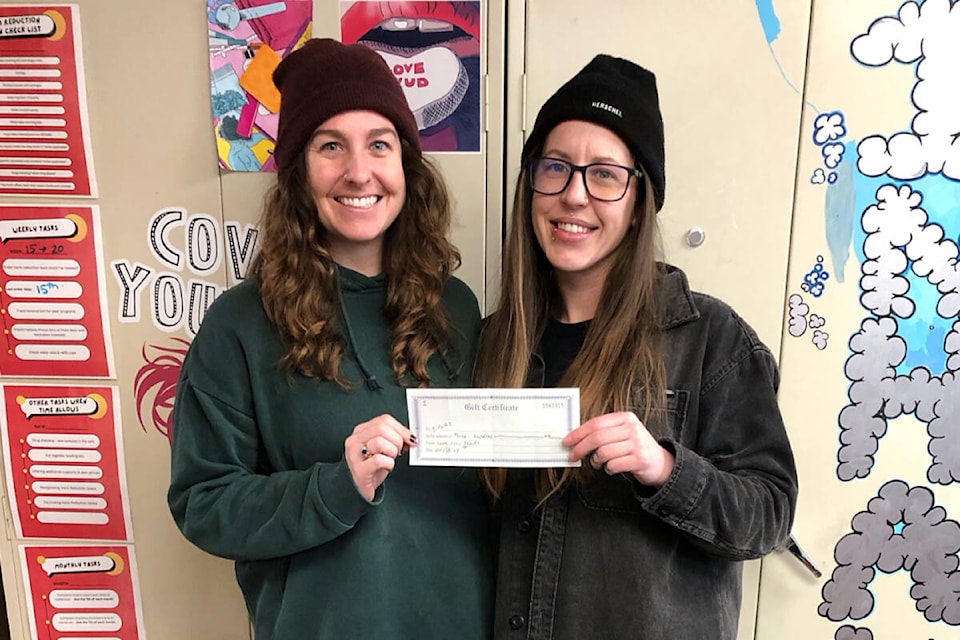 When Lake Trail Thrift Shop called for support, a community member went and bought a gift card for $300. They donated it to AVI in Courtenay, so people experiencing homelessness could buy clothing. The card is worth up to 150 items. AVI staff Chelsey Davis and Taija McLuckie pose with the donation. They say thank you! (Photo submitted by Kayla Funk) 