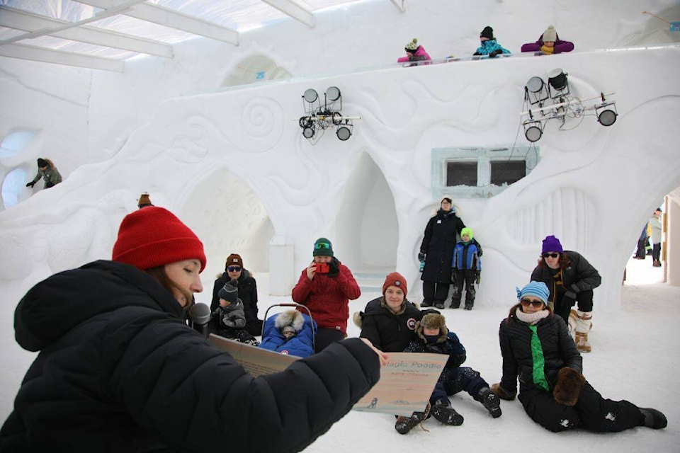 Jessie Wilson reads her book ‘Gabby the Magic Poodle’ to visitors at the Snow Castle on Sunday. Kaicheng Xin/NNSL photo 