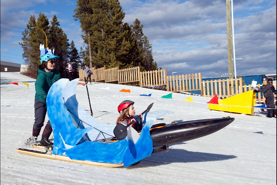 Contestants in a soapbox sledding derby race down the hill behind the Whitehorse Cross Country Ski Club’s chalet on the afternoon of March 17. The activity was part of the ski club’s Spring Nordic Festival, which also included a relay race, snowshoe tour, and curling. There was also live music, food and a beer garden for attendees to enjoy. (Matthew Bossons/Yukon News) 