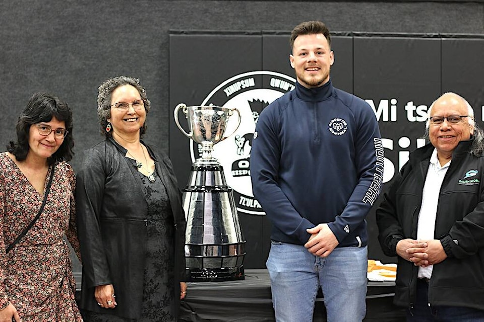 Cowichan Tribes councillors Debra-Ann Toporowski and Swutth’tus Calvin Swustus flank chief Sulsulxumaat Cindy Daniels and 2023 Grey Cup winner Brock Gowanlock of the Montreal Alouettes on Monday, March 18 as the football player returned to his hometown with the trophy to present Cowichan Tribes chief and council with his Orange Shirt Day team warm up jersey. (Sarah Simpson/Citizen) 
