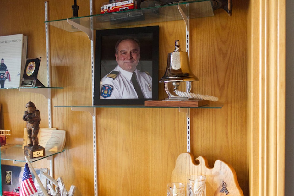 Lance Caven’s photo sits in the foyer of the Langford Fire Hall #1, where he is remembered alongside other firefighters who had passed away. (Thomas Eley/ News Staff) 