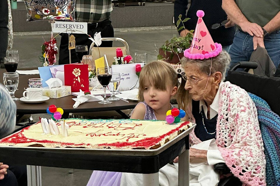 Clara Grootveld blew out the candles with a young family member at her birthday bash from the Schubert Centre on Monday, March 18. (Bowen Assman - Morning Star) 