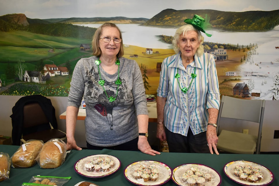 Lesley Hannas, left, and Dana Ball sell baking Friday, March 15 at the Williams Lake Seniors Activity Centre Shamrock Luncheon. (Monica Lamb-Yorski photo - Efteen) 