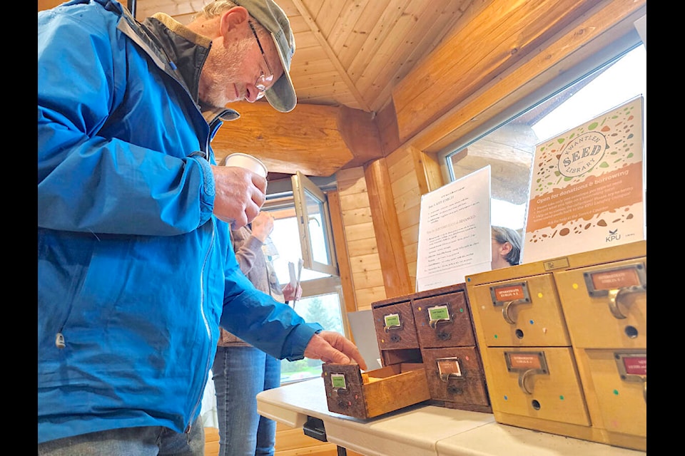 A visitor looks through a “seed library” at the Rotary Interpretive Centre in the Derek Doubleday Arboretum on Saturday, March 23rd during the annual “Seedy Saturday”seed exchange and gardening event organized by Langley Environmental Partners Society. (Dan Ferguson/Langley Advance Times)  