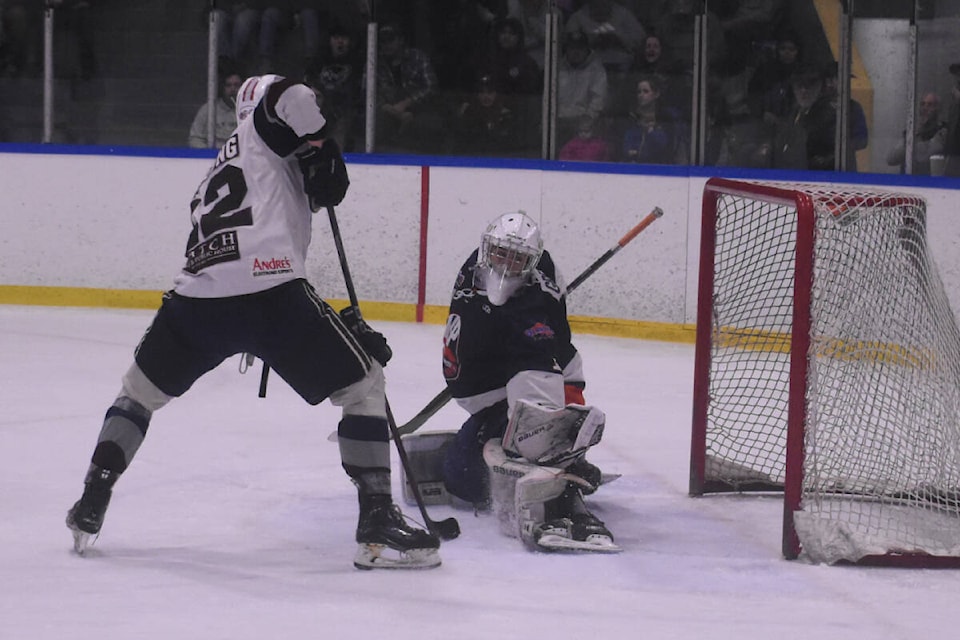 Kerry Park Islander goalie Ryder Gregga gets his pad out for a save against Comox Valley Glacier King forward Logan Furlong in Game 7 of their VIJHL semifinal series. The Islanders hung on for a 3-2 victory to advance to the championship series against the Saanich Predators. Photo by Terry Farrell/Comox Valley Record 