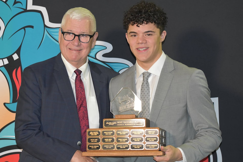Tij Iginla (right) was named the Kelowna Rockets team Most Valuable Player on Thursday, Mar. 21 as he accepted the award from team and president Bruce Hamilton. (Jordy Cunningham/Capital News) 