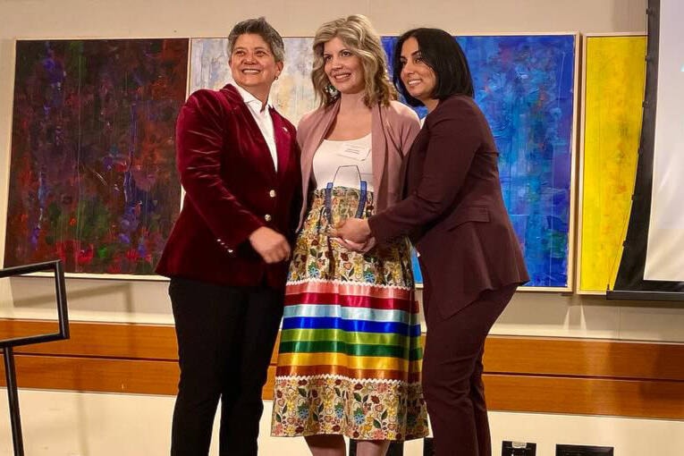 Anetha Kashuba accepts the Breaking Barriers award for her Indigenous Learning Tour project with the Okanagan Indian Band. (MLA Harwinder Sandhu photo) 