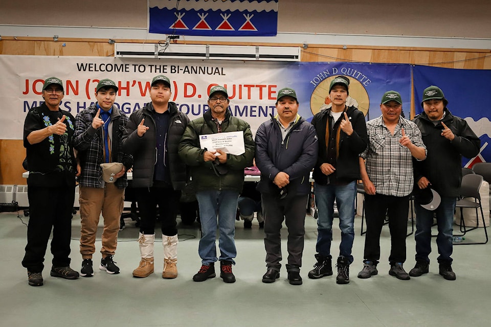 From left, Alfred Arrowmaker, Davan Wedawin, Keith Wetrade, Charlie Wetrade, David Wedawin, Peter Black, Roger Drybones and David Chocolate pose for a photo after winning the John D. Quitte Men’s Handgames Tournament in Gameti. They took home the $30,000 top prize. There were 32 teams competing for a piece of the tournament’s $100,000 pot. Photo courtesy of Peter John Apples 