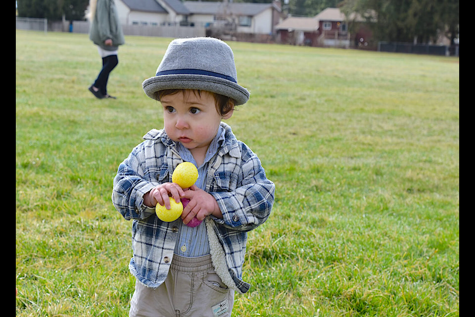Dapper dude Cayson Green had no need for a basket, opting instead to juggle his three eggs at Sicamous’ annual Easter Egg Hunt in Finlayson Park Saturday morning, March 30. (Heather Black-Eagle Valley News) 