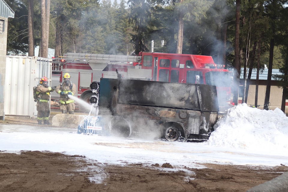 The smoldering hull of the burnt out Zamboni ice machine being cooled down by Clearwater Volunteer Fire team members on March 19 following a sudden fire that quickly engulfed the machine before fire crews arrived in two trucks to put the fire out before it could spread to nearby structures. (Photo by: Zephram Tino) 