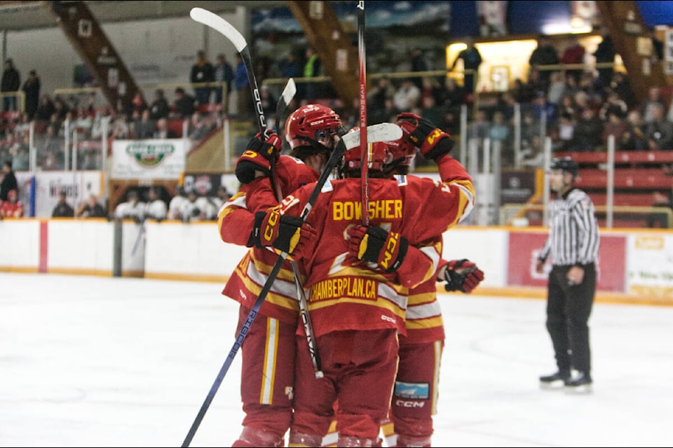 The Flames celebrate a goal. Paul Rodgers photo. 