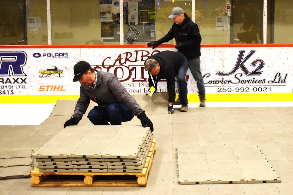 During the Lhtako Quesnel BC Winter Games, Quesnel staff and volunteers got hands-on experience with the floor tiles used to cover ice sheets, allowing pedestrian events to happen during the winter sports season. (Frank Peebles photo - Quesnel Cariboo Observer) 