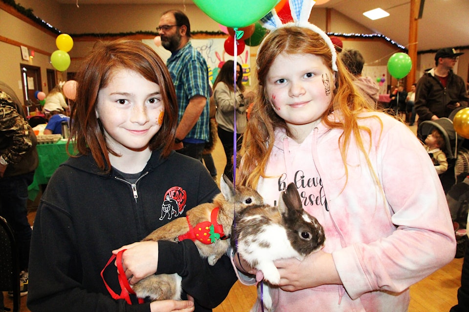 Alvin Heintz and Paetyn Goldbaum brought their pet rabbits Caramel and Tony to What’s Hoppening in 100 Mile House at the 100 Mile Community Hall on Saturday, March 30. (Patrick Davies photo - 100 Mile Free Press) 