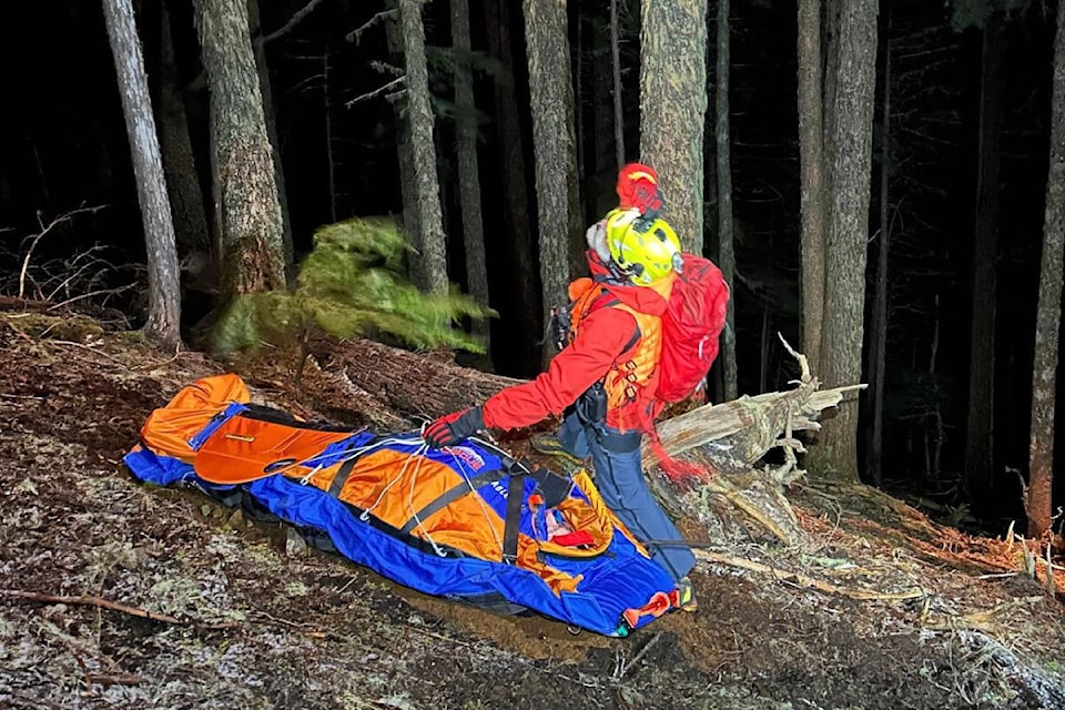 A search and rescue volunteer awaits a hoist from North Shore Search and Rescue with a hiker injured on Mt. Arrowsmith on April 6, 2024. (PHOTO COURTESY AV RESCUE SQUAD) 