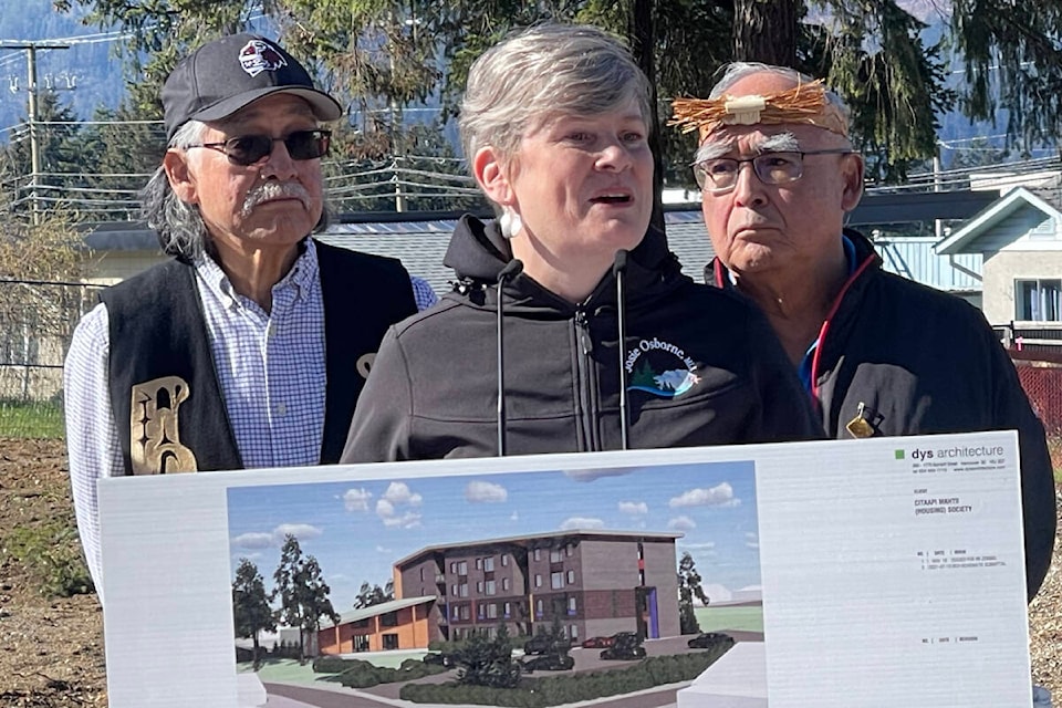 Wally Samuel Jr., left, and Cliffe Atleo, right, listen as Mid Island-Pacific Rim MLA Josie Osborne congratulates the Ahousaht First Nation, City of Port Alberni and BC Housing on the sod-turning for the 35-unit Citaapi Mahtii Project. (April 5, 2024) (SUSIE QUINN/ Alberni Valley News) 