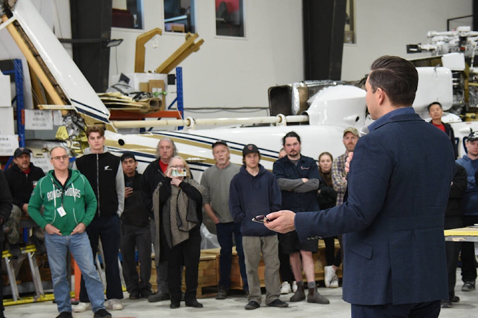Employees from Coulson Aviation and Conservative Party supporters listen to party leader Pierre Poilievre during a private event in Port Alberni on Thursday, April 4, 2024. (SUSIE QUINN/ Alberni Valley News) 