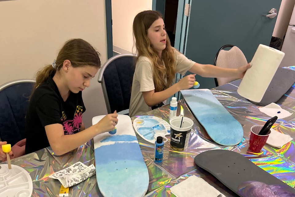 Qualicum Beach Skaters involved the youth in creating art on skateboards that will be sold at the Arts On Wheels auction on Saturday, April 6. (Contribute photo) 
