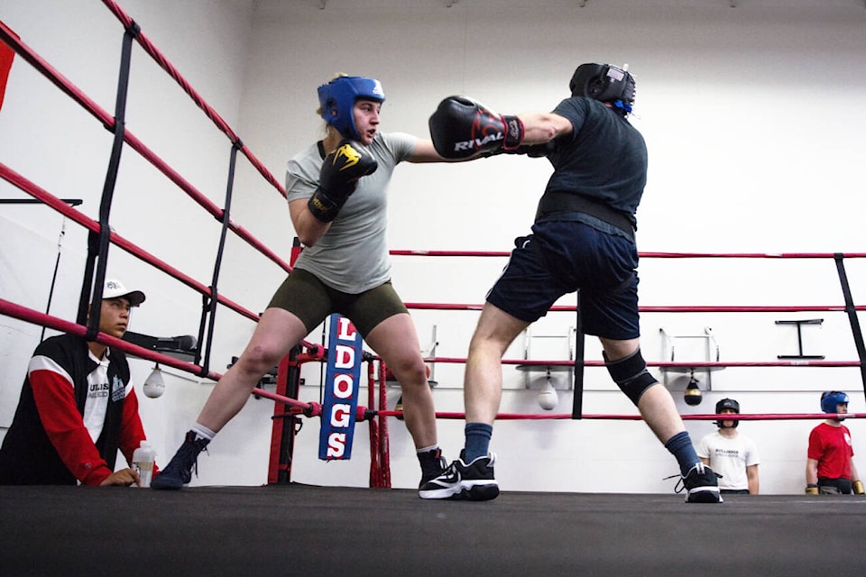 Keisha Lacroix lands a blow on Ryan Hornung during a sparring showcase and fundraiser at Bulldogs Fitness and Boxing Centre on Saturday, April 6, 2024. The event was held as a “dry run” leading into the 6th Annual Hit2Fit Charity Gala on April 27. (Kayleigh Seibel Photography) 