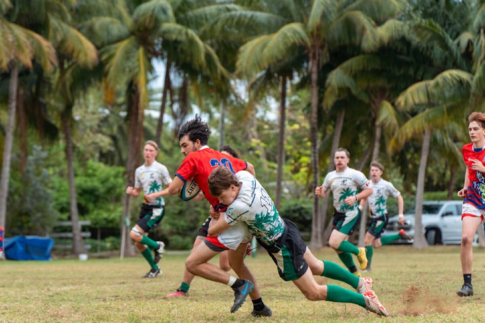 Yeti Rugby Club U18 player Jute Norlin tackles a Grand Cayman player during recent competition at Grand Cayman. (Selina Metcalfe/Ihana Images photo) 