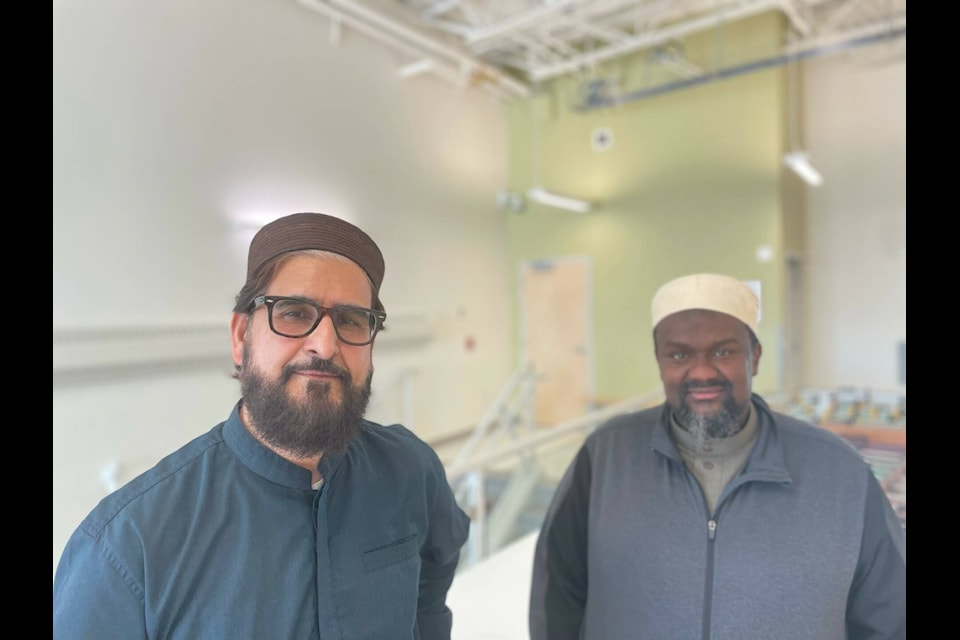 Nazim Awan, left, and Habib Hassan stand outside the gymnasium at Ecole Allain St. Cyr on Friday. Awan said that, largely, Yellowknife’s community has been very welcoming. Devon Tredinnick/NNSL photo 