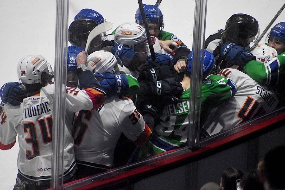 Chaos erupts after Tristen Nielsen is assessed a match penalty for a check to the head on Saturday (April 6). (Ben Lypka/Abbotsford News) 