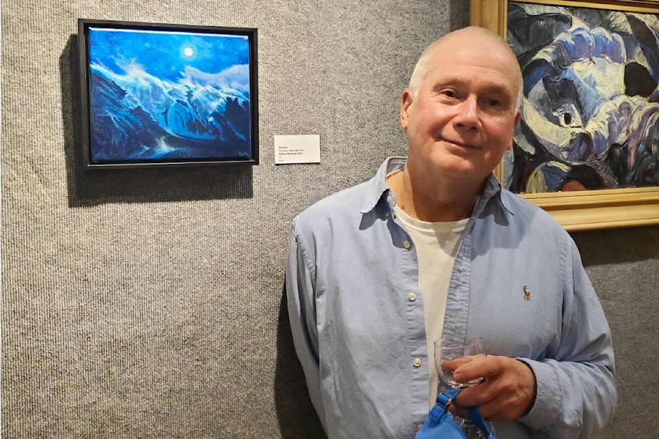 Lillooet artist William Matthews with his painting Stardust depicting the view from his home in Lillooet. (Monica Lamb-Yorski photo - Efteen) 