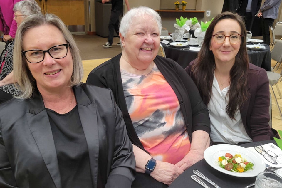 Sharon Wood (center), volunteer with Langley Hospice Society, was awarded the Eric Flowerdew Volunteer award on Thursday, April 11. (Kyler Emerson/Langley Advance Times) 