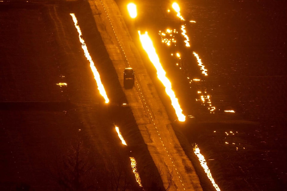 web1_240413-lat-rh-lensfasulloroadablaze-lou_1
