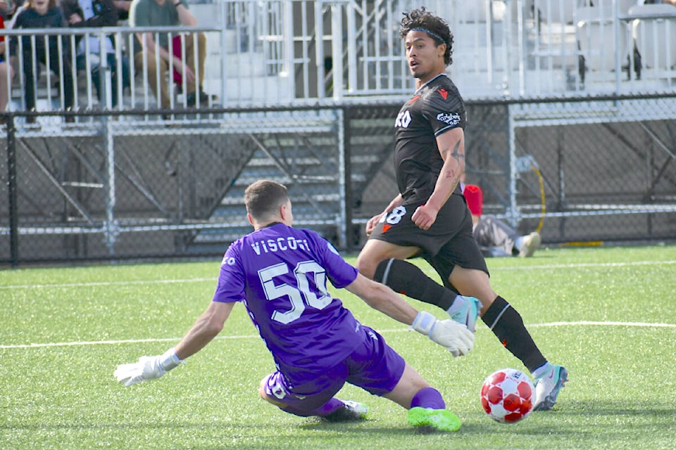 A first-half goal by Vancouver FC’s Moses Dyer tied the game against Valour FC at Langley’s Willoughby Community Park on Sunday, April 14. VFC went on to win their season opener 4-1, setting a new club record of four goals in a single game. (Dan Ferguson/Langley Advance Times) 