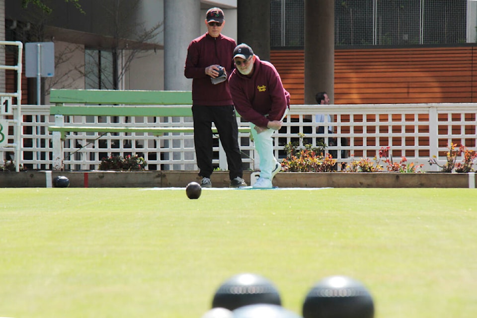 Lorne Carnes, president of the Canadian Pacific Lawn Bowling and Croquet Club plays on a sunny April afternoon on the downtown Victoria greens. (Christine van Reeuwyk/News Staff) 