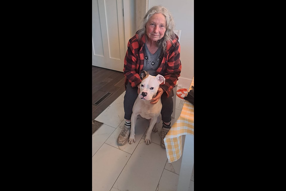 Leslie Long stands with Gucci, a boxer who was rescued from Northern Manitoba. Gucci has been adopted and has found her fur-ever home (Photo courtesy of Leslie Long) 