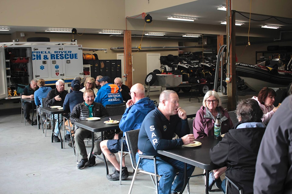 Volunteers and sponsors share a meal at the Campbell River Search and Rescue building on Sunday, April 14. Photo by Marc Kitteringham/Campbell River Mirror 