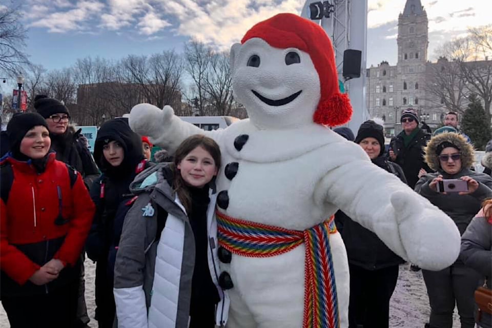 Rylen Brens from the Alberni Valley visits with ‘Bonhomme Carnaval’ during a trip to Quebec. (SUBMITTED PHOTO) 