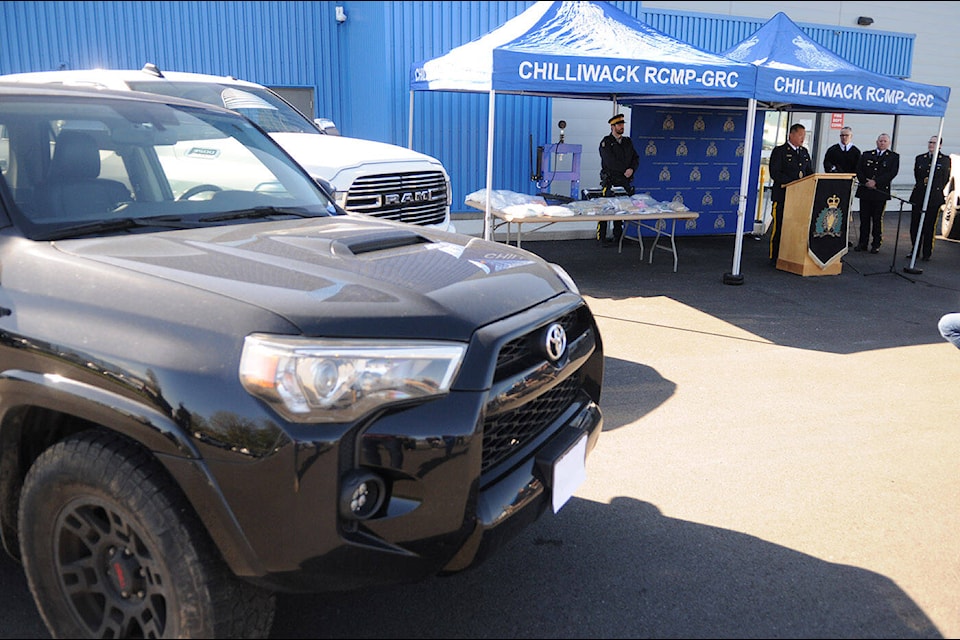 Supt. Davy Lee speaks during a press conference in Chilliwack on Wednesday, April 17, 2024. Pictured here are some of the items seized from a large drug bust including $300,000 in vehicles, $500,000 in cash, and $5 million in street drugs. (Jenna Hauck/ Chilliwack Progress) 