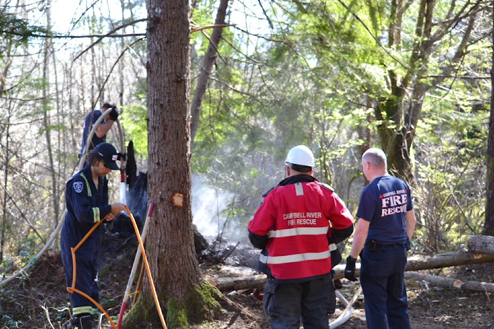 Campbell River Fire Rescue work to contain the scene of a small brush fire south of Jubilee. Photo by Brendan Kyle Jure/Campbell River Mirror. 