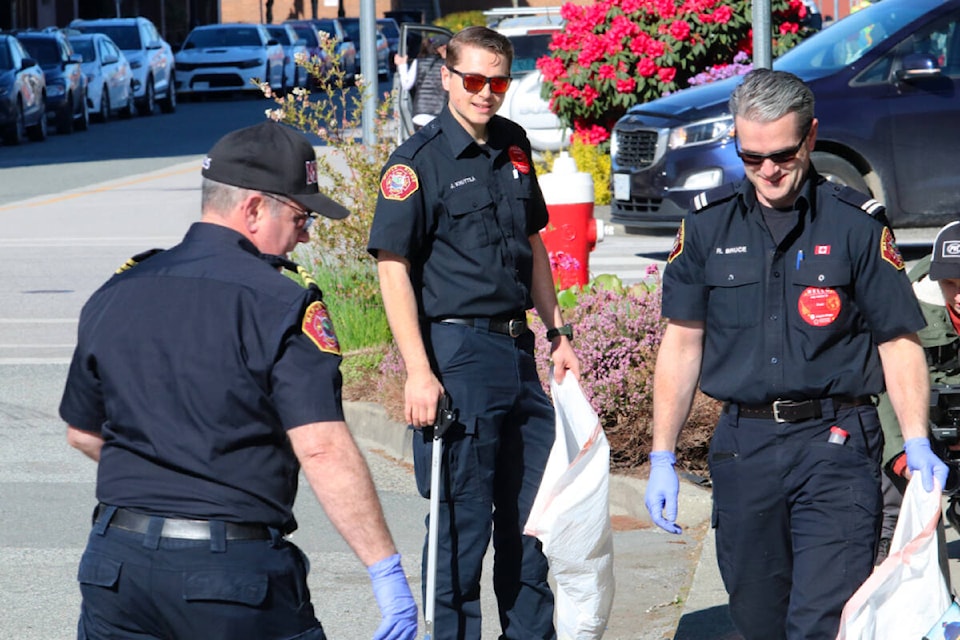 Members of Maple Ridge Fire and Rescue participated in the Blitz Day volunteer cleanup in downtown Maple Ridge on April 17. (Brandon Tucker/The News) 