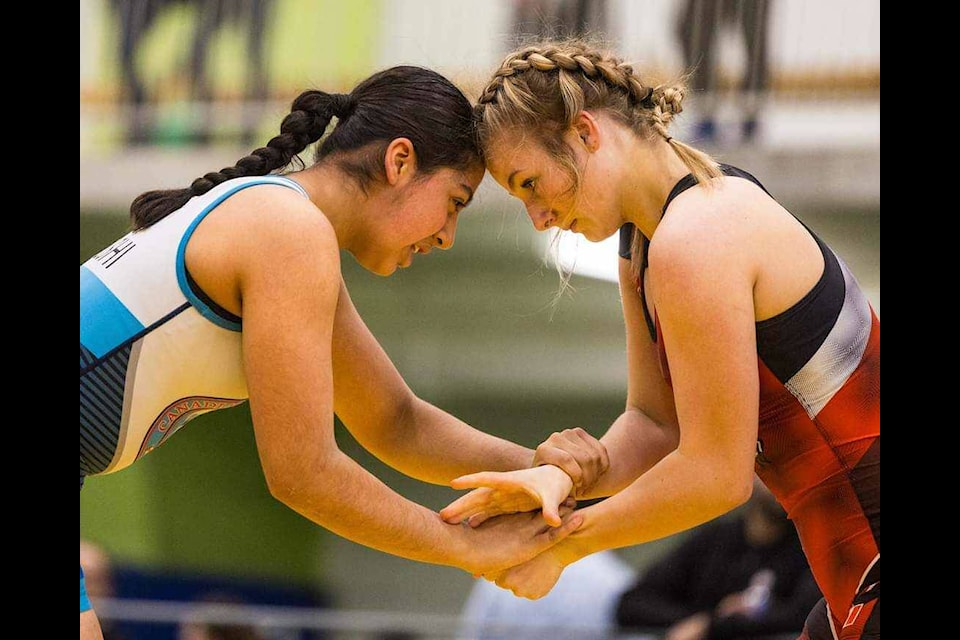 The Cowichan Valley Wrestling Club’s Emma Greenwood (right) engages with an opponent during the Canadian National Championships April 5-7 in Mississauga, Ont. (Wrestling Canada photo) 