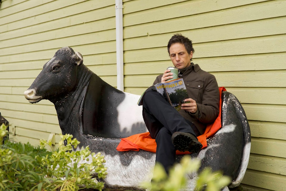 Jonny Harris, star of the hit CBC show Still Standing, enjoys a hot beverage outside the Cow Bay Gift Galley during filming the week of April 8 - 14. (Evan Seccombe photo) 