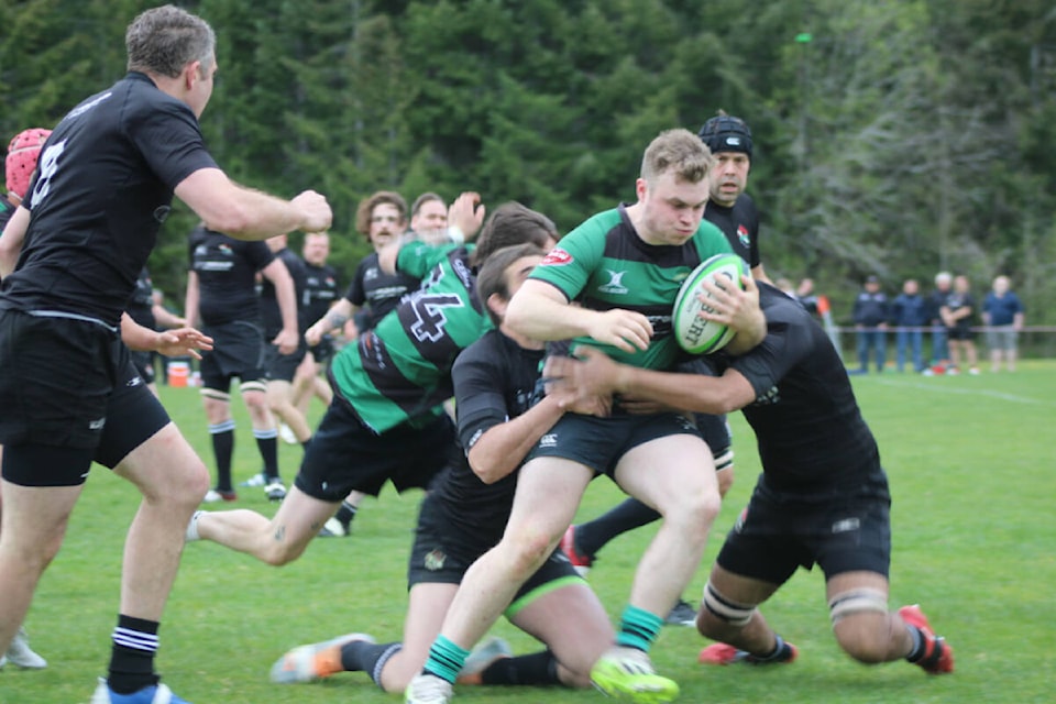 The Port Alberni Black Sheep team up to take down a Cowichan player during BC rugby playoff action on April 20. (SONJA DRINKWATER PHOTO) 