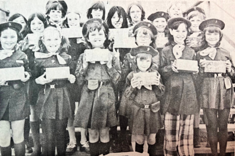 ‘Cookie Day Saturday April 27’ (April 25, 1974): ‘Cache Creek Brownies who will be selling cookies on “Cookie Day”: (l to r back row) Nancy Yee, Fidelma Taylor, Karen Munro, Wendy Kalenith, Laurie Heinemann. (l to r centre row) Sophia Montsos, Lyn Smith, Cindy Yee, Rosemarie Schleg, Brenda McNirney. (l to r front row) Leah Smith, Debbie Smith, Annette Pittman, Jackie Corley, Kathy Harris, Patty Evans. (front right of centre) Lisa Chretien, who will present a “Gold Nugget” to Mrs. Gurd, Chief Commissioner, Girl Guides of Canada, at a ceremony to be held at Lytton May 4 and 5.’ (Photo credit: <em>Journal</em> archives) 